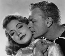 Eddie Albert and Gita Hall in The Gun Runners (1958)