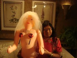 from Outsourced episode 122 char. Pinky with the doll.