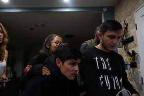 Arnold, Bryan Bachman, watches Playback and receives direction with Director of Photography, Elvin Yolchiev, on the set 