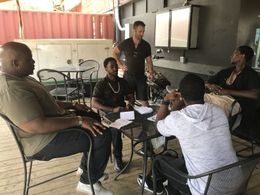 Fredrick Bam Scott with Edi Gathegi, Ben Ketai, Jarred Wofford and Jevon White on the set of “StartUp” S3 discussing the