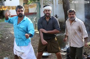 Maniyanpilla Raju, Prithviraj Sukumaran, and Anoop Menon in Paavada (2016)