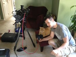 Rob Imbs on set with his cat.