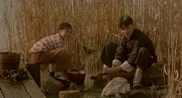 Qianquan Yang and Xiaoxiao Wang in Shanghai Triad (1995)