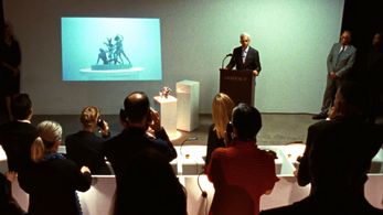 Neal Mayer as The Auctioneer in 