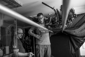 Jason and his cinematographer, Pascal Combes-Knoke discussing the bathtub overhead shot on the set of Uh Oh