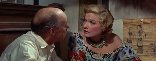 Russell Collins and Anna Sten in Soldier of Fortune (1955)