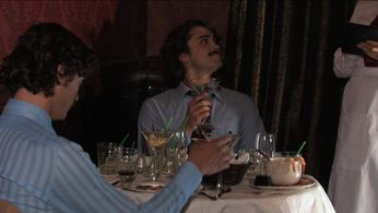 Billy (Sean Carlin),wearing a fake moustache, orders another round of amaretto and pineapple while Paul (Josiah Lipscom