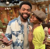 Joshua Triplett and Tichina Arnold on set of The Neighborhood