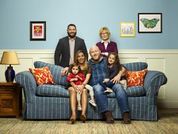 The United We Fall family, from left on couch: Ireland Carvajal as Lulu Ryan, Christina Vidal as Jo Ryan, Will Sasso as 