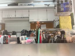 In the hair and makeup chair prior to set. These talented professionals can even make me look good.