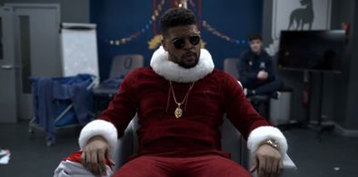 Isaac as Santa Claus in ted lasso Christmas episode