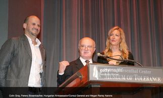 The Sibs (Colin Keith Gray & Megan Raney Aarons) learn they will receive the Order of the Knight's Cross from Hungary at
