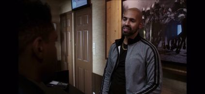 Jon Michael Hill and Armando Acevedo in Elementary (2012)