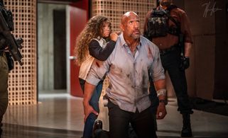 Dwayne Johnson and McKenna Roberts in Skyscraper (2018)