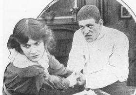Pauline Bush and Lon Chaney in Her Escape (1914)