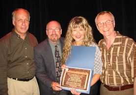 William Greville, George Adams, Klaudia Kovacs, and John Rengstorff celebrating 