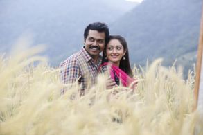 Karthi and Sayyeshaa Saigal in Kadaikutty Singam (2018)