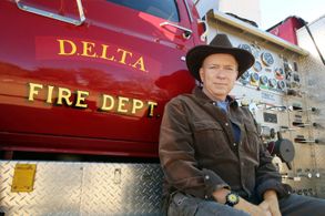 Leo with Bigger Red -- one of his four fully operational fire engines. 