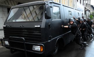 Pierre Gruno, Joe Taslim, and Iko Uwais in The Raid: Redemption (2011)