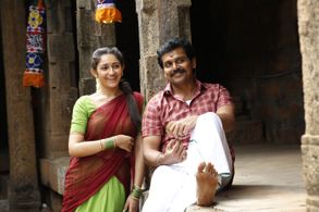 Karthi and Sayyeshaa Saigal in Kadaikutty Singam (2018)