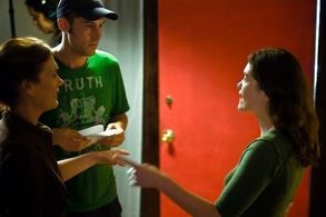 Director Brian Feeney rehearses a scene with actresses Alisha Seaton and Judy Clement on the set of 
