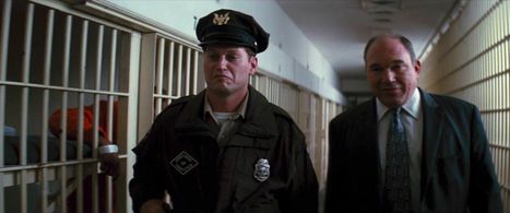 Wade Williams, Michael James Faradie, and Patrick Cox in The Dark Knight Rises (2012)