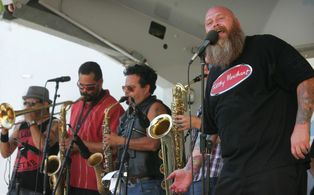 Frank singing with his band.