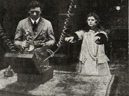 Neva Gerber and Ben F. Wilson in The Voice on the Wire (1917)