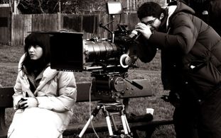 Still of Amit Gupta with Shelley Conn during the filming of Love Story.
