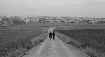 Ninetto Davoli and Totò in The Hawks and the Sparrows (1966)