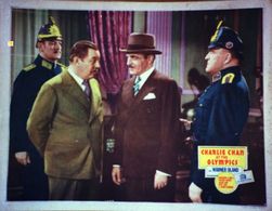 C. Henry Gordon, Warner Oland, and Frederik Vogeding in Charlie Chan at the Olympics (1937)