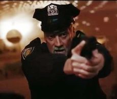 Unnerved policeman answering a domestic disturbance in Ludvig Gur's timely adaptation of H.P. Lovecraft's 