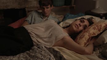 Ella Hatamian and Giles Matthey in Hunter (2013)