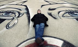 Writer-director Eric Nazarian in front of the La Payasa set mural on the Los Angeles River for his first film, “The Blue