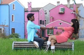 Genelia D'Souza and Dhanush in Uthama Puthiran (2010)