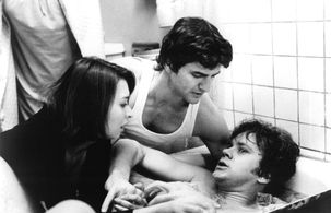 Tim Robbins, Elizabeth Peña, and Anthony Alessandro in Jacob's Ladder (1990)