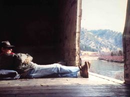 Bobb Hopkins aka Santa Fe Bo riding a freight in Montana