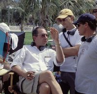 Sonnenfeld (left) discusses a scene on set with producer Barry Josephson (center).
