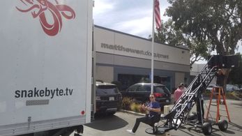 Tyler Phillips (CEO Matthews, and Kurtis Anton, CEO Snakebyte Productions, llc exchanging classic Tulip crane at Matthew