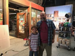 Isaak Bailey on set Kim's Convenience with Paul Sun-Hyung Lee.