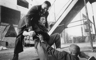 Jean-Claude Van Damme, Vojislav Govedarica, and Michel Qissi in Lionheart (1990)