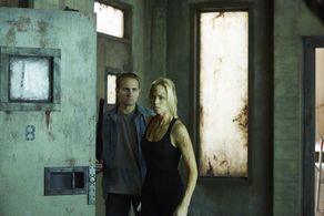 Laura Vandervoort and Paul Johnston in Bitten (2014)