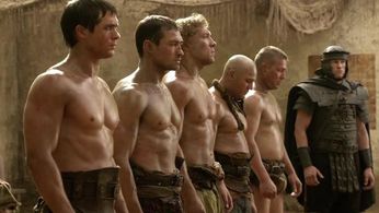 Andy Whitfield, Jai Courtney, and Kyle Pryor in Spartacus (2010)