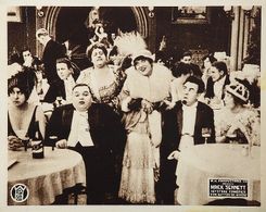 Roscoe 'Fatty' Arbuckle, Alice Davenport, May Emory, Mabel Normand, and Ford Sterling in That Little Band of Gold (1915)