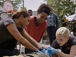 J. Nicole Brooks, Monica Raymund, and Kara Killmer in Chicago Fire (2012)