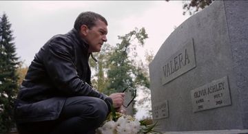 Frank Valera (Antonio Banderas) visits the grave of his daughter Olivia (Lillian Blankenship) and wife Sue (Cristina Ser