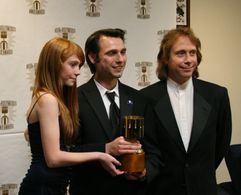Presenters Liliana Mumy (l) and Bill Mumy (r) with Michal Makarewicz, winner for feature character animation