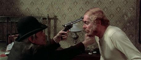 Klaus Kinski and Jean Martin in A Genius, Two Partners and a Dupe (1975)