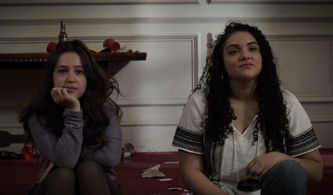 Gideon Adlon and Kiara Pichardo in The Society (2019)