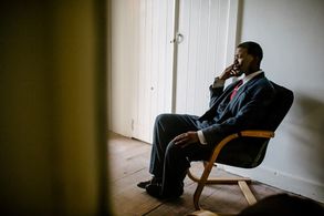 A pensive Atandwa Kani on the set of The Suit (2016)